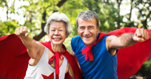 Seniors dressed as superheroes happy about medicare plans