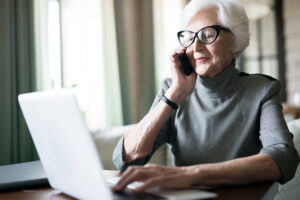senior getting medicare help from agent over phone