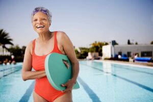 woman on medicare staying active at the pool