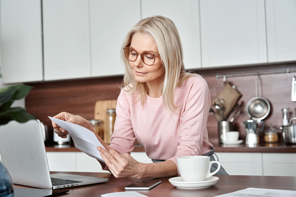 A photo of a lady reviewing her Medicare Annual Notice of Change