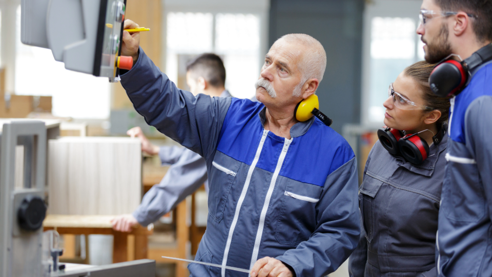 older man working in a factory