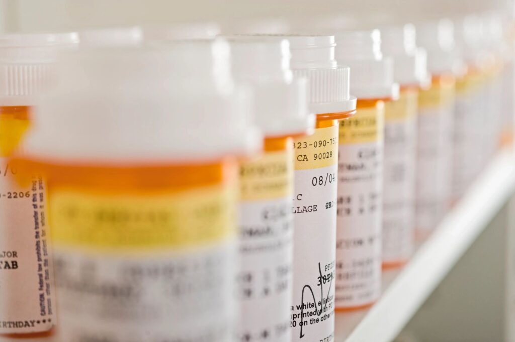part d prescription bottles in a row.